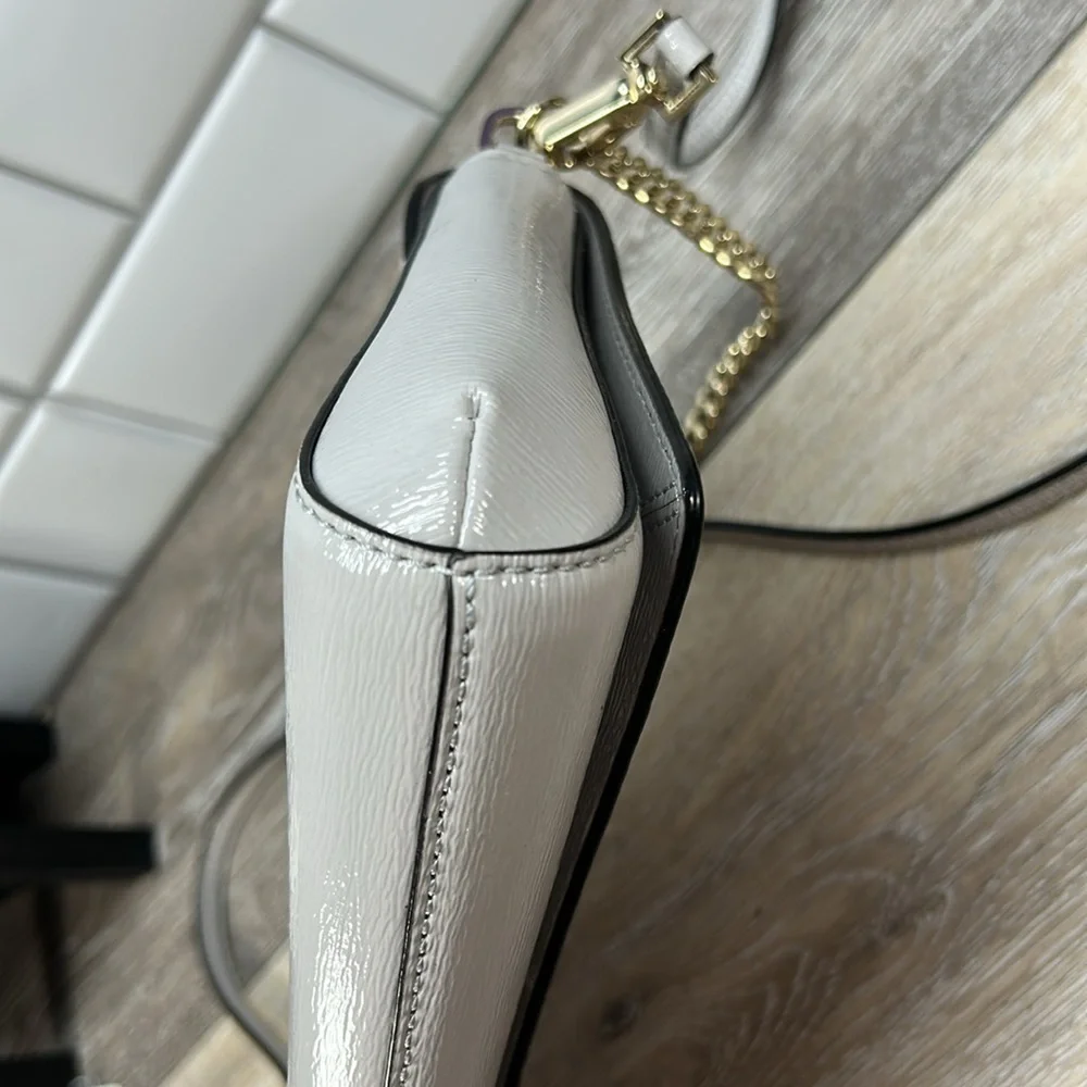 Kate Spade gray crossbody with gold chain